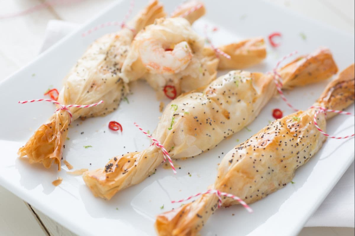 Paquetitos navideños con langostinos, jengibre y lima
