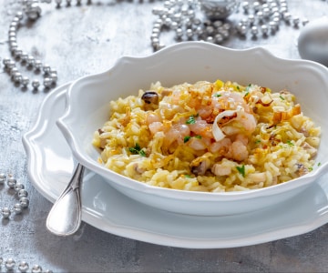 Risotto de naranja con pez espada y gambas