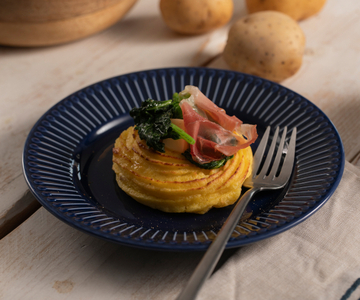 Nidos de patatas duquesa con grelos