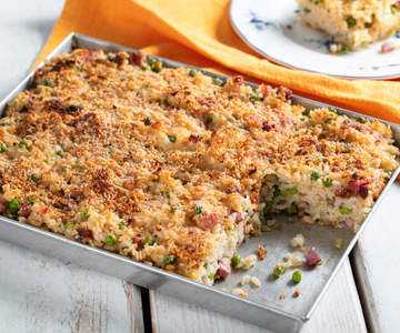 Arroz al horno con guisantes y speck